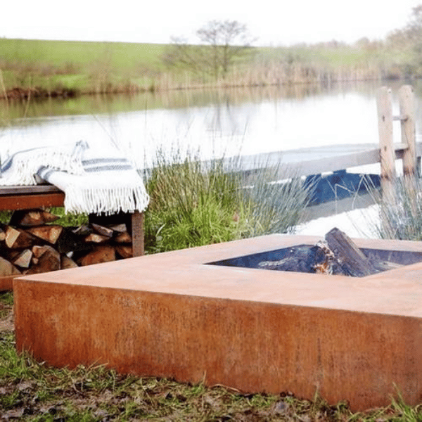 Corten Steel Flama Fire Table by river