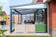 Outdoor patio area with a pergola and furniture on a sunny day.