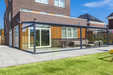 Modern patio extension with glass walls on a residential property