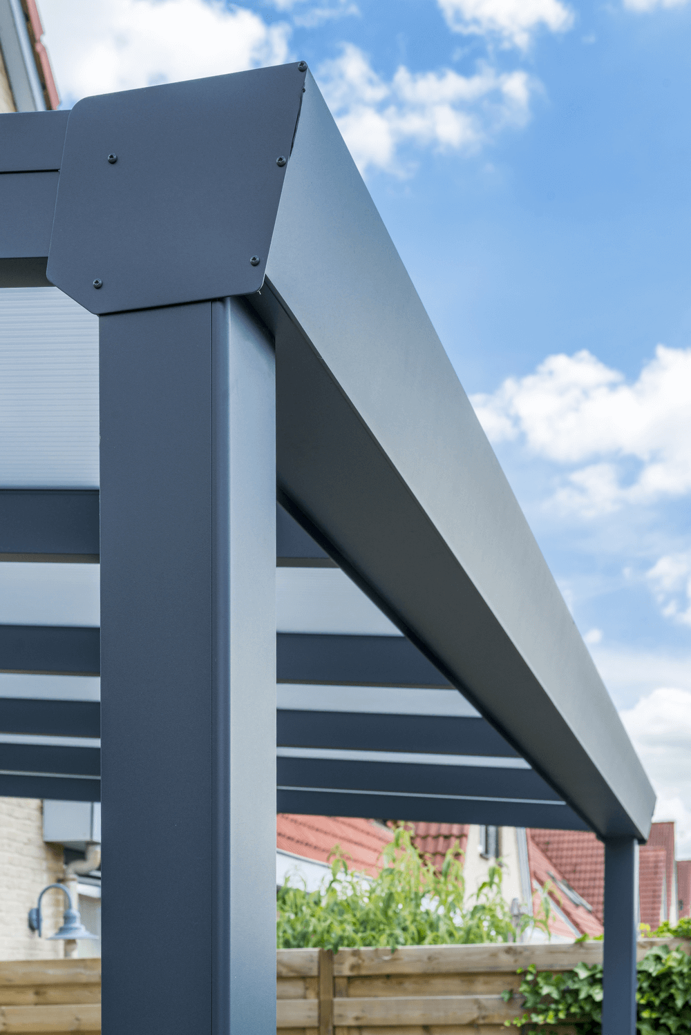 Metal pergola structure with a clear blue sky background
