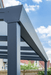 Metal pergola structure with a clear blue sky background
