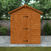 Wooden shed with a gabled roof in a garden setting