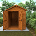 Wooden shed with open doors in a garden setting