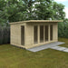 Wooden garden shed with a paved area in a garden setting