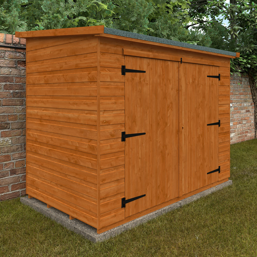 Wooden shed with double doors against a brick wall and greenery
