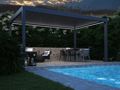 Patio with Pinela Deluxe, outdoor furniture, and pool at night