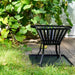 HEAT square base plate under a fire basket on garden decking