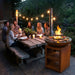 Friends dining outdoors at night beside a HEAT Bakka plancha grill