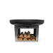 HEAT Fresvik fire bowl on its steel base with stored logs, side view