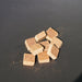 HEAT wood fibre firelighter cubes on a dark surface