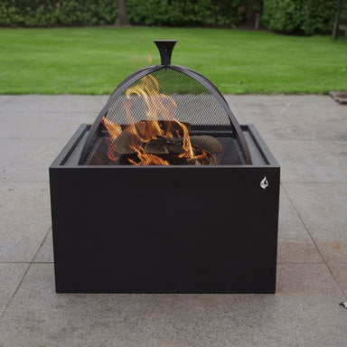 HEAT 3 in 1 fire pit burning under its spark dome on a patio