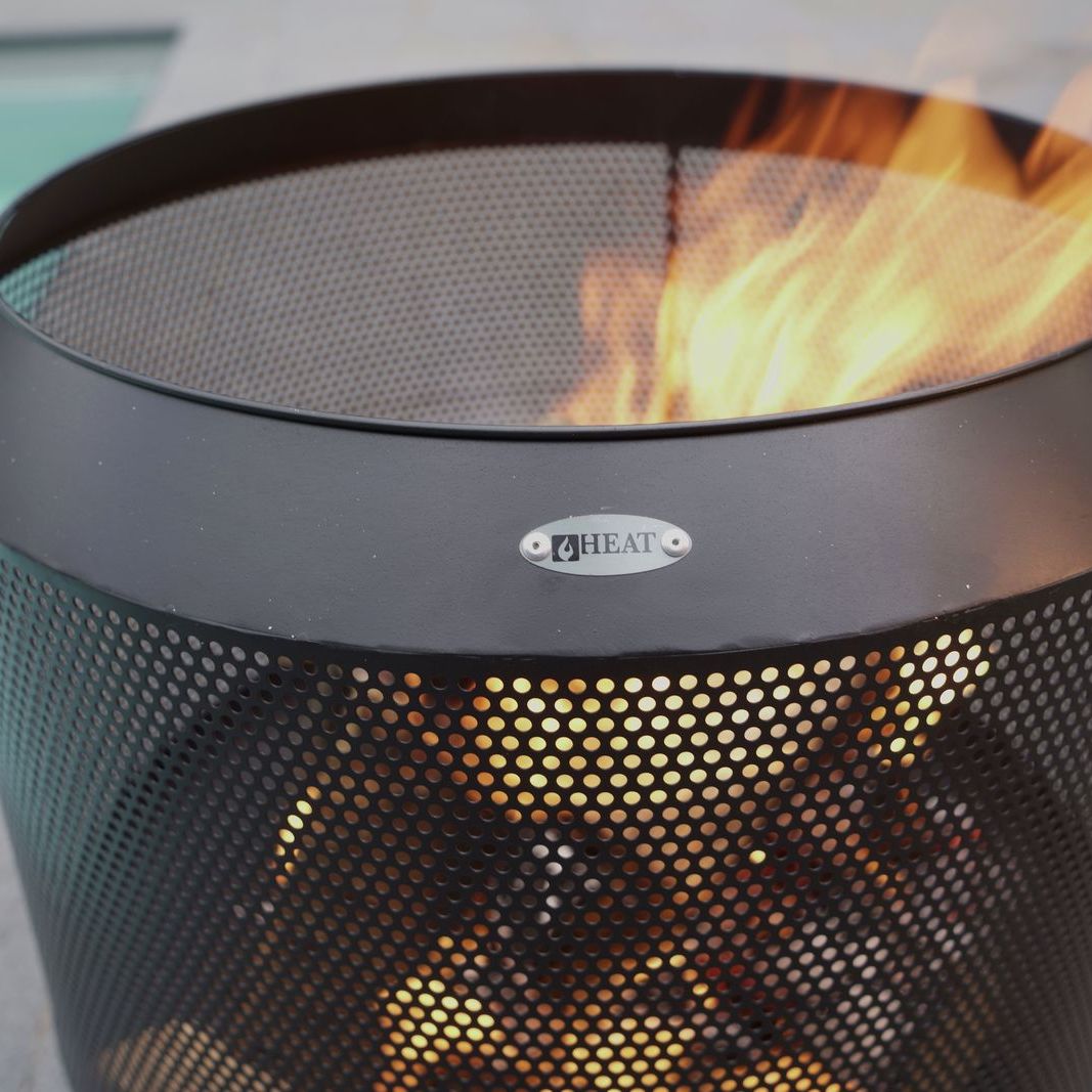 Close-up of flames inside the HEAT Fire Drum perforated steel basket