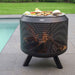 Food cooking on the HEAT Fire Drum grill by a swimming pool
