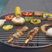 Kebabs, corn and vegetables on the HEAT Fire Drum grill grid