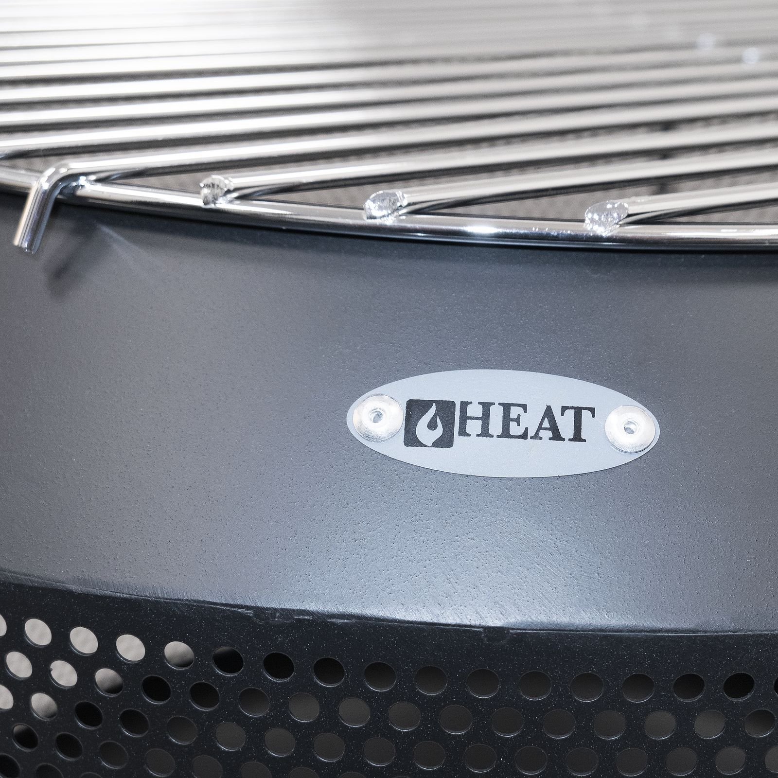 Close-up of the HEAT badge and grill on the Fire Drum