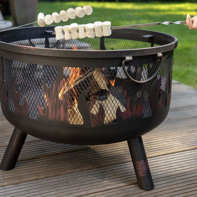 Marshmallows toasting over the HEAT Hornset fire pit on garden decking