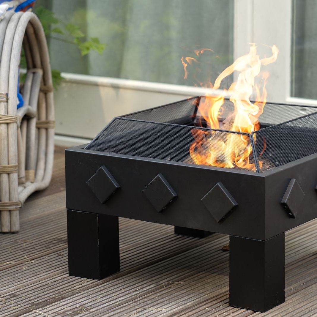 HEAT Kvadrat square fire bowl with flames on garden decking, close view