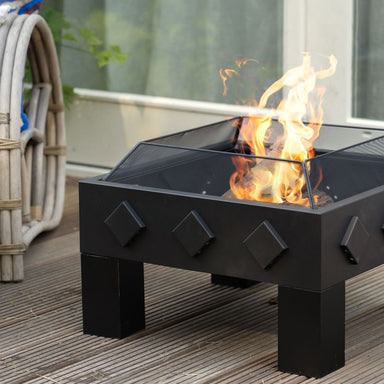 HEAT Kvadrat square fire bowl with flames on garden decking, close view