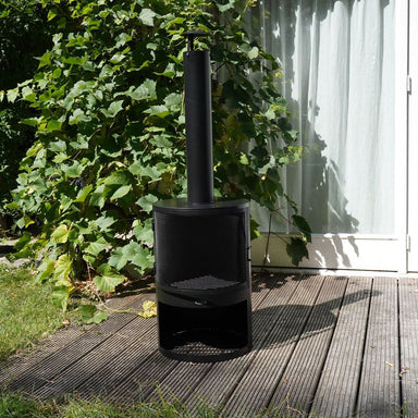 HEAT Hamar outdoor fireplace on decking beside climbing plants