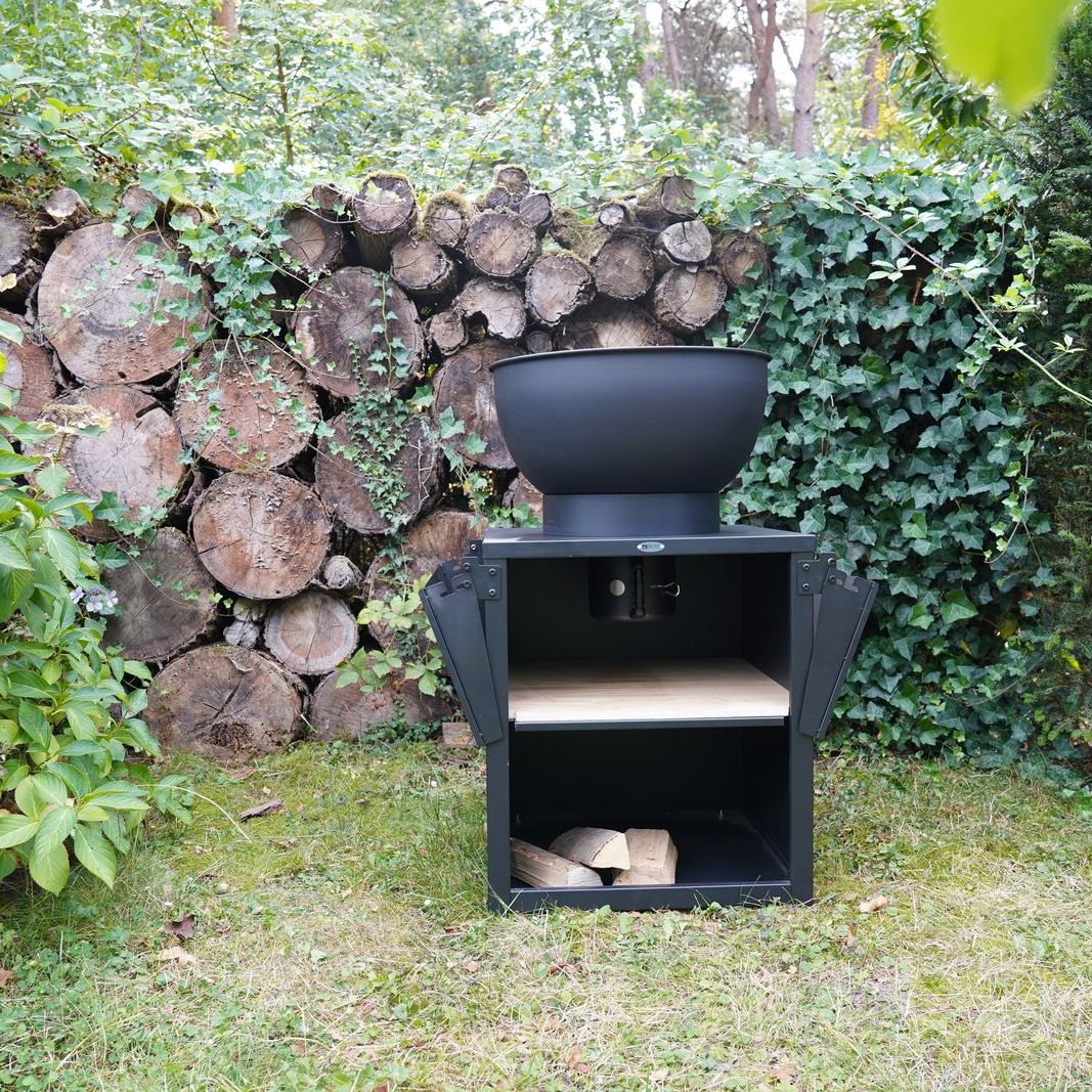 HEAT Kjok outdoor kitchen with benches folded and logs stored below