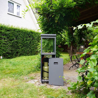 HEAT Utevarme patio heater with gas bottle door open in a garden