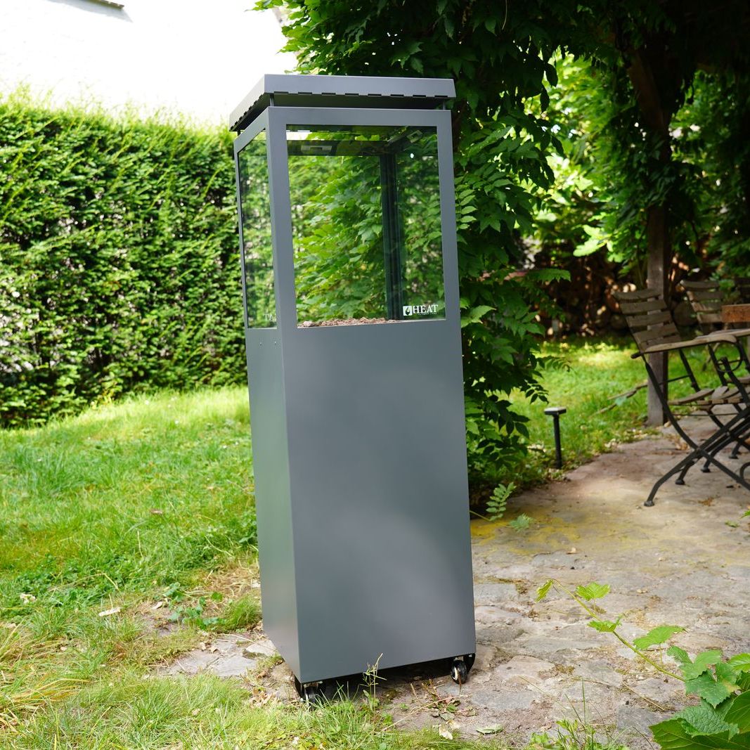HEAT Utevarme grey patio heater on a garden path