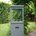HEAT Utevarme patio heater with flame lit in a green garden