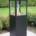 HEAT Utevarme black patio heater with flame lit in a garden