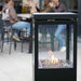 HEAT Utevarme black patio heater warming a cafe terrace