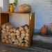HEAT Dokka rust steel log store filled with logs on a patio